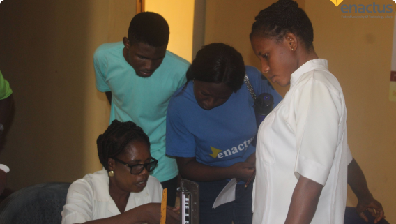 Image of Enactus Futa members in a discussion